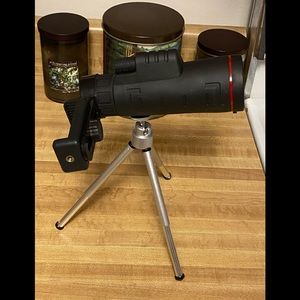 Monocular with accessories and stand.